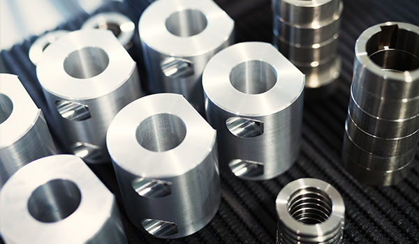 metal cylindrical parts arranged together showcasing precision engineering and manufacturing techniques 4 unique designs